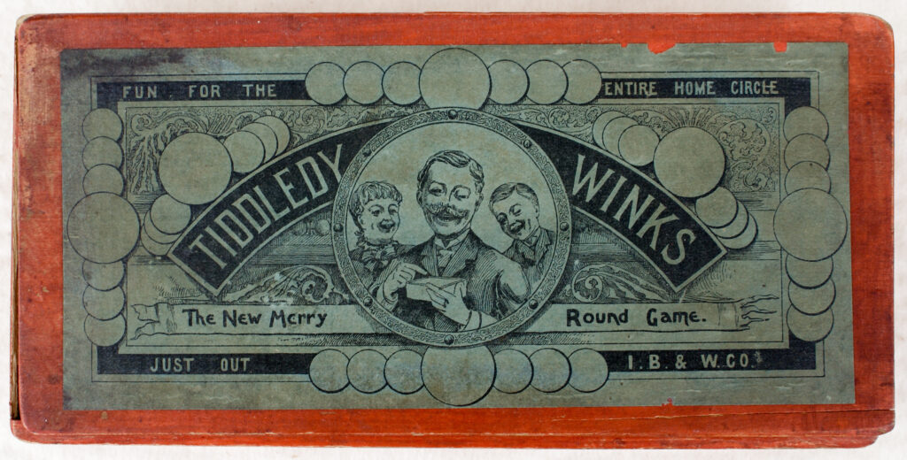 Tucker Tw ID • IBW-02c1 — AGPI ID • G-29865c1 — publisher • I. B. & W. Co. [Ives, Blakeslee, — title • TIDDLEDY WINKS The New Merry Round Game. — notes • In a red wooden box. — keywords • game, game cover, gc-image