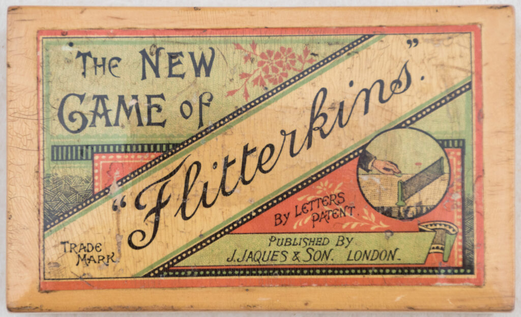 Tucker Tw ID • JAQ-10c1 — AGPI ID • G035104c1 — publisher • J. Jaques & Son (London) — title • THE NEW  GAME of "Flitterkins" — notes • "BY LETTERS PATENT". "TRADE MARK". "PUBLISHED BY J. JAQUES & SON, LONDON.". Mauchline box. — keywords • game, game cover, gc-image, net, sport, tennis