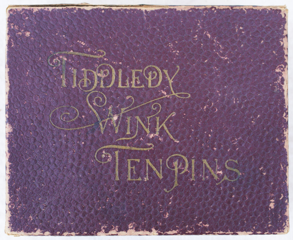 Tucker Tw ID • UNK-010v3c1 — AGPI ID • G-39668c1 — publisher • (not marked, USA) — title • TIDDLEDY WINK TEN PINS — notes • Dark red cardboard cover with leatherette texture. Rules label under box lid.